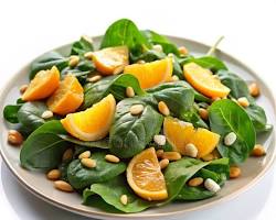 Ensalada de espinaca fresca con gajos de naranja y nueces